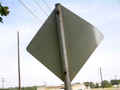 Chickadee nesting in stop sign. Keith Kridler photo.